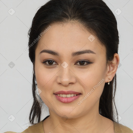 Joyful latino young-adult female with medium  brown hair and brown eyes