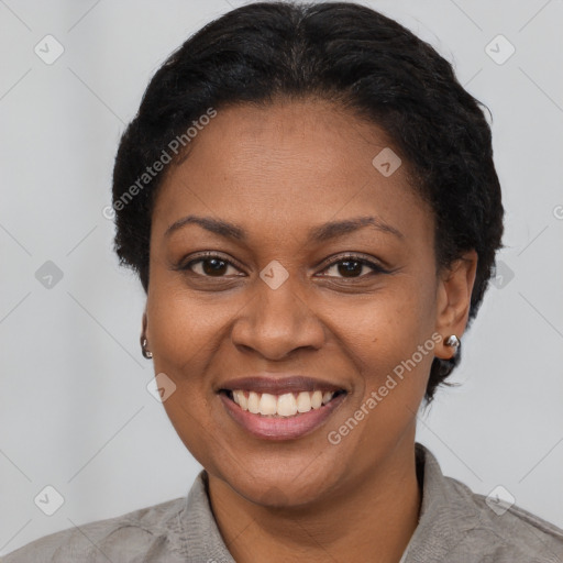 Joyful latino adult female with short  brown hair and brown eyes