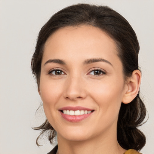 Joyful white young-adult female with medium  brown hair and brown eyes