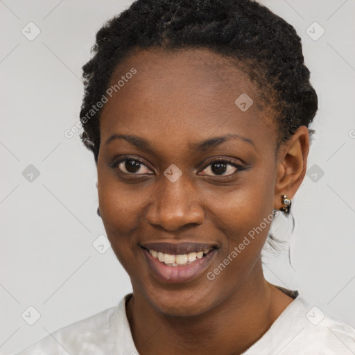 Joyful black young-adult female with short  black hair and brown eyes