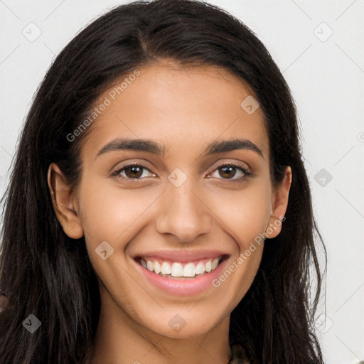 Joyful latino young-adult female with long  brown hair and brown eyes