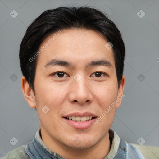 Joyful asian young-adult male with short  brown hair and brown eyes