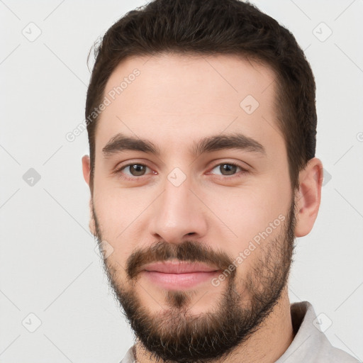 Neutral white young-adult male with short  brown hair and brown eyes