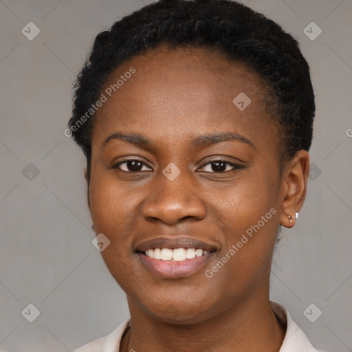 Joyful black young-adult female with short  black hair and brown eyes