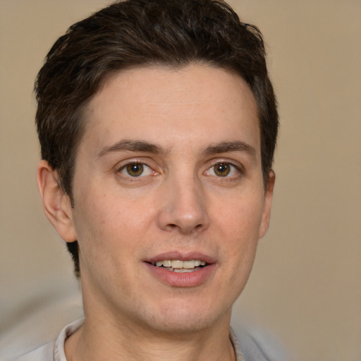 Joyful white adult male with short  brown hair and brown eyes