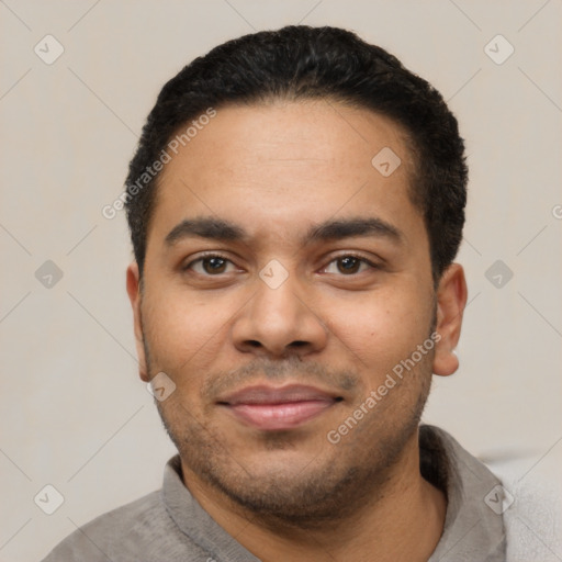 Joyful latino young-adult male with short  black hair and brown eyes