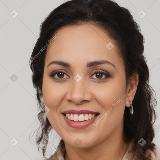 Joyful latino young-adult female with long  brown hair and brown eyes