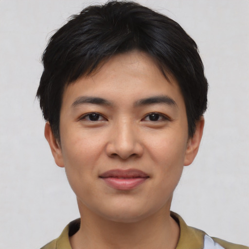 Joyful asian young-adult male with short  black hair and brown eyes