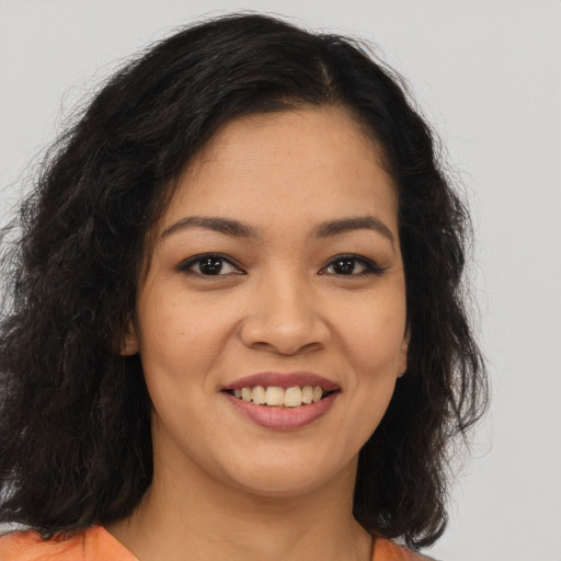 Joyful asian young-adult female with long  brown hair and brown eyes