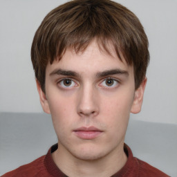 Neutral white young-adult male with short  brown hair and grey eyes