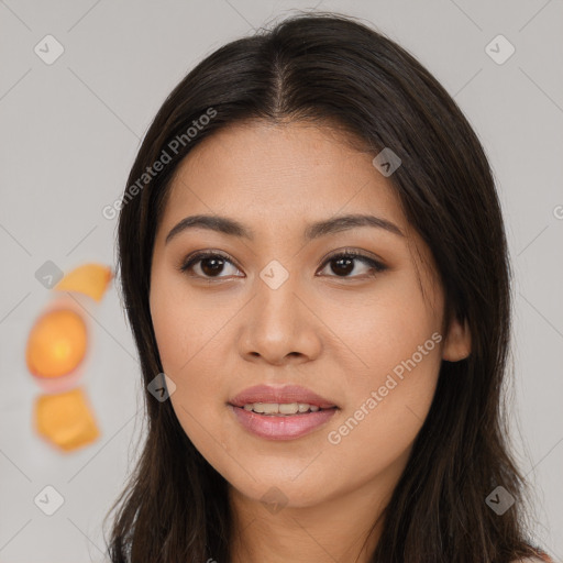 Joyful asian young-adult female with long  brown hair and brown eyes