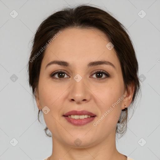 Joyful white young-adult female with medium  brown hair and brown eyes