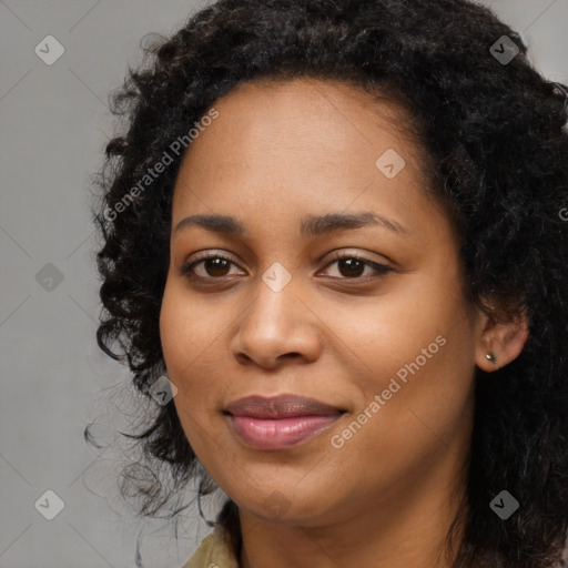 Joyful black young-adult female with long  black hair and brown eyes