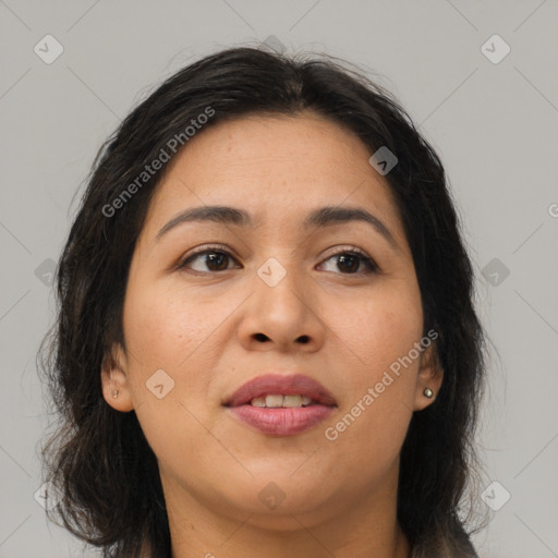 Joyful asian young-adult female with long  brown hair and brown eyes