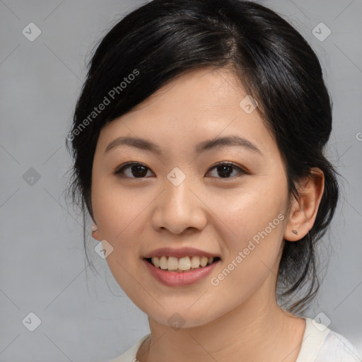 Joyful asian young-adult female with medium  black hair and brown eyes