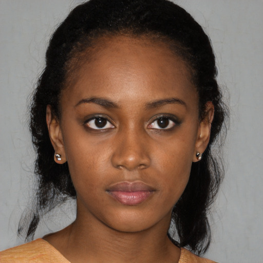 Neutral black young-adult female with medium  black hair and brown eyes