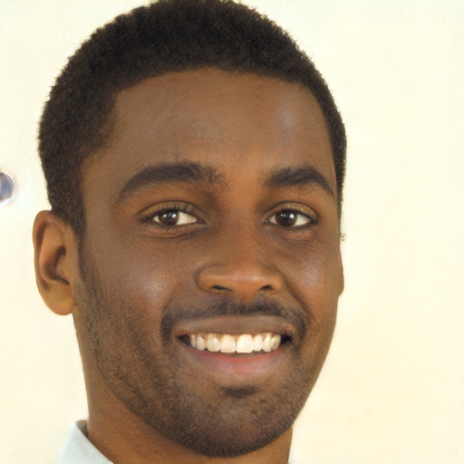 Joyful black young-adult male with short  brown hair and brown eyes