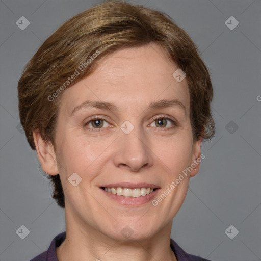 Joyful white adult female with short  brown hair and grey eyes