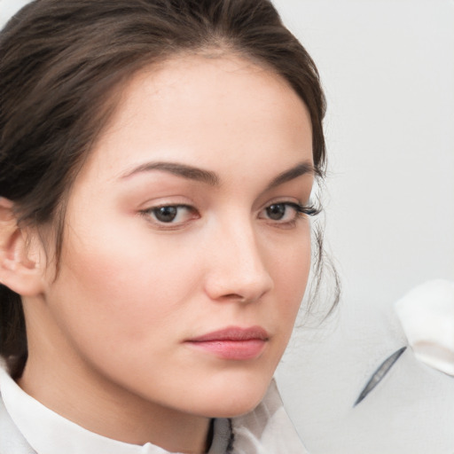 Neutral white young-adult female with medium  brown hair and brown eyes