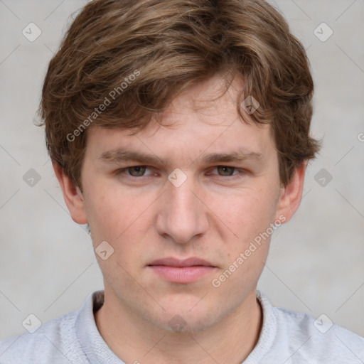 Neutral white young-adult male with short  brown hair and blue eyes