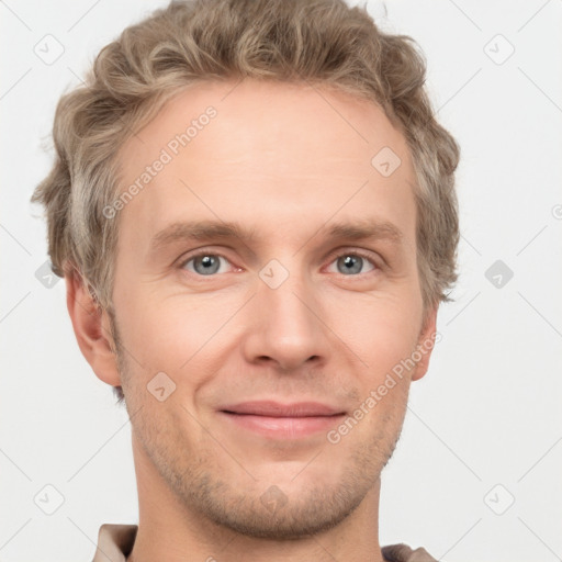 Joyful white adult male with short  brown hair and grey eyes