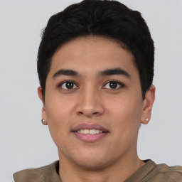 Joyful asian young-adult male with short  brown hair and brown eyes