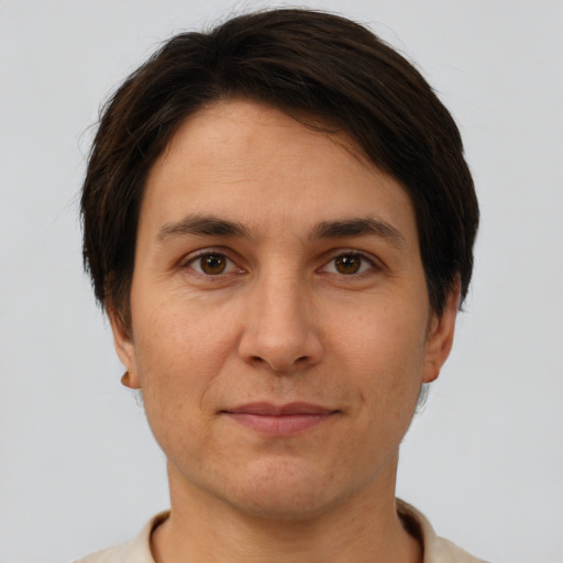 Joyful white adult female with short  brown hair and brown eyes