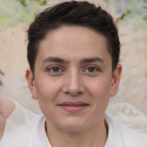 Joyful white young-adult male with short  brown hair and brown eyes