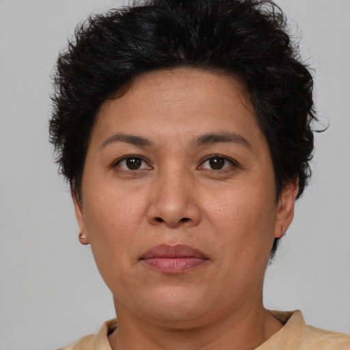 Joyful white adult female with short  brown hair and brown eyes