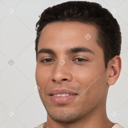 Joyful white young-adult male with short  black hair and brown eyes