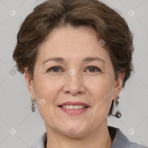 Joyful white adult female with short  brown hair and grey eyes