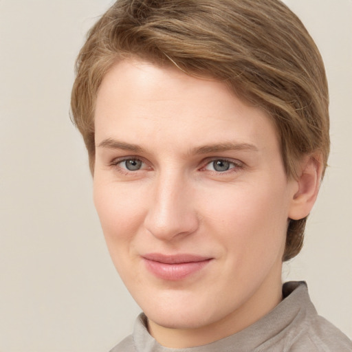 Joyful white young-adult female with short  brown hair and grey eyes