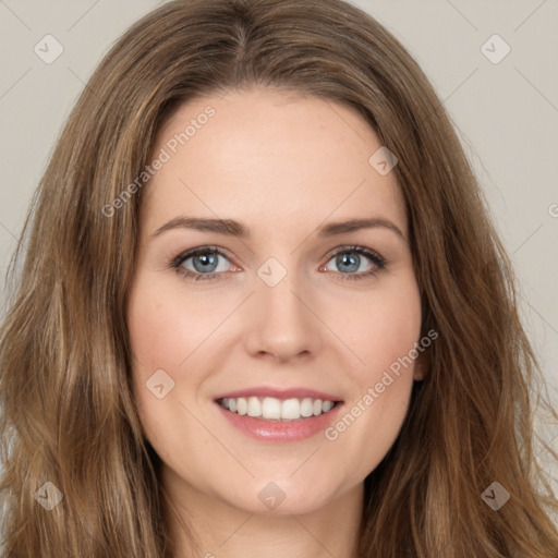 Joyful white young-adult female with long  brown hair and green eyes