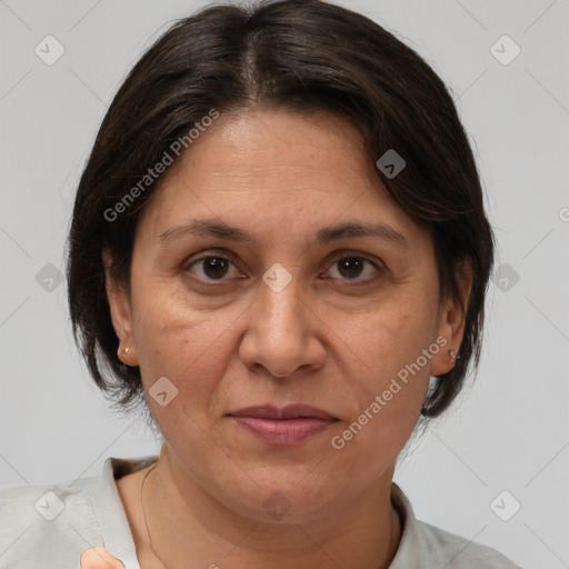 Joyful white adult female with medium  brown hair and brown eyes