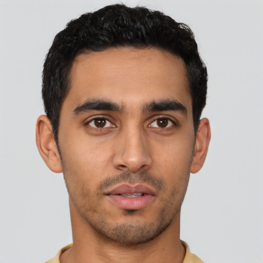 Neutral latino young-adult male with short  black hair and brown eyes