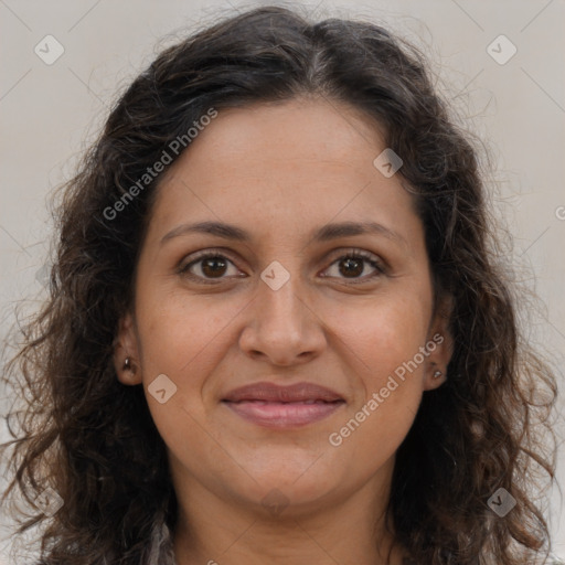 Joyful white adult female with long  brown hair and brown eyes