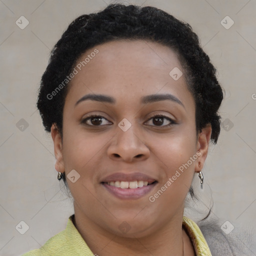 Joyful black young-adult female with short  brown hair and brown eyes