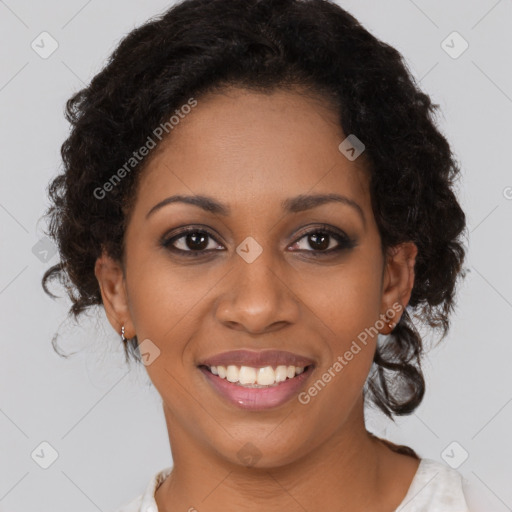 Joyful black young-adult female with medium  brown hair and brown eyes