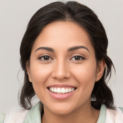 Joyful white young-adult female with medium  brown hair and brown eyes