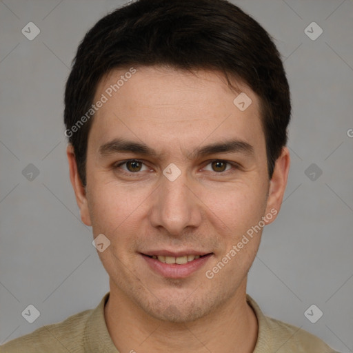 Joyful white young-adult male with short  brown hair and grey eyes