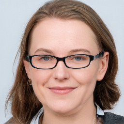 Joyful white young-adult female with medium  brown hair and blue eyes