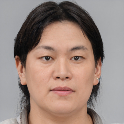 Neutral asian young-adult female with medium  brown hair and brown eyes