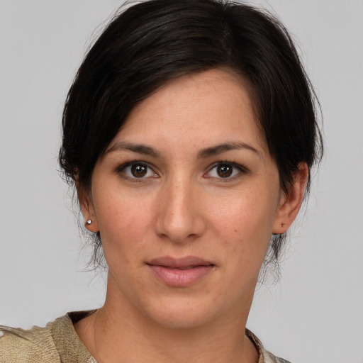 Joyful white young-adult female with medium  brown hair and brown eyes