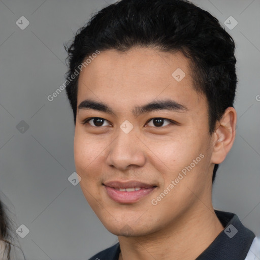 Joyful white young-adult male with short  black hair and brown eyes