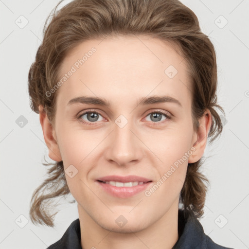 Joyful white young-adult female with medium  brown hair and blue eyes