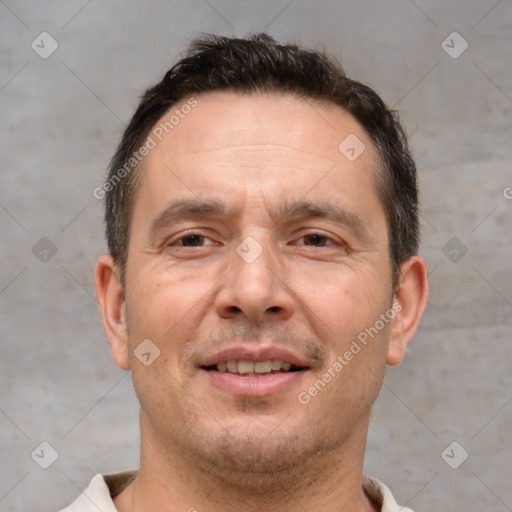 Joyful white adult male with short  brown hair and brown eyes