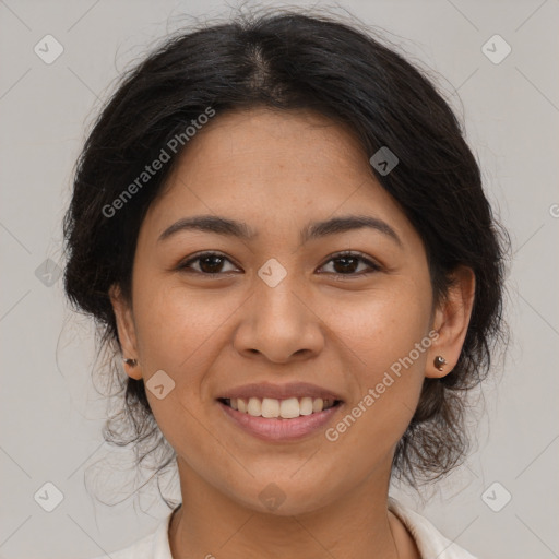 Joyful latino young-adult female with medium  brown hair and brown eyes