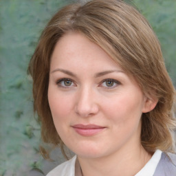 Joyful white young-adult female with medium  brown hair and blue eyes