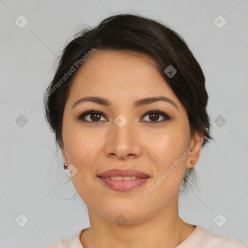 Joyful latino young-adult female with medium  brown hair and brown eyes