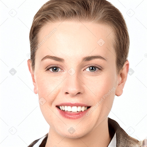 Joyful white young-adult female with short  brown hair and grey eyes